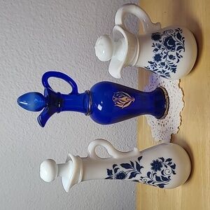 Avon set of three milk glass and blue glass pitcher.